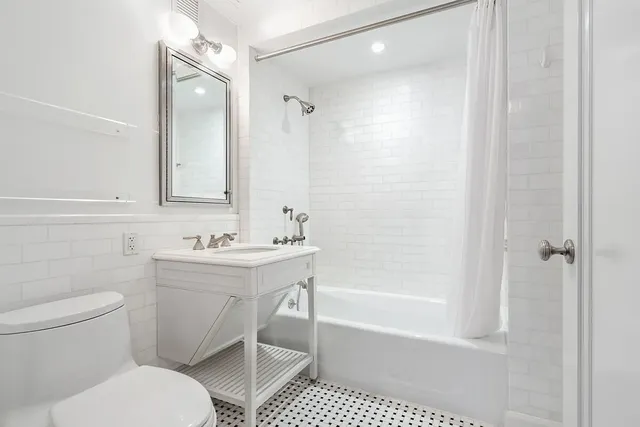 a bedroom with a bed and a table