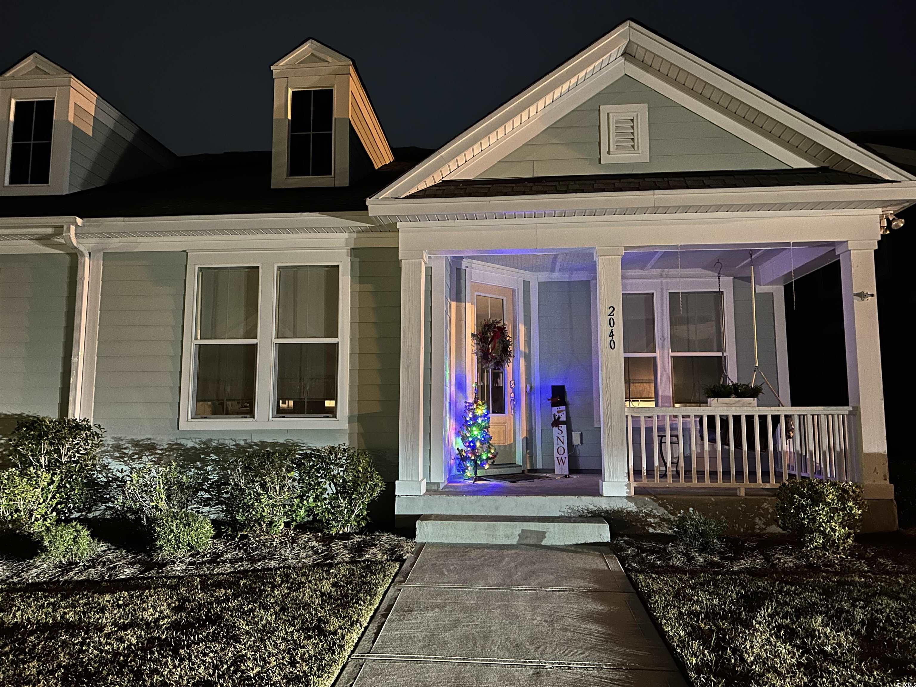 2040 Silver Island Way Murrells Inlet, SC 29576 - Photo 2 of 40 Exterior entry at night featuring covered porch