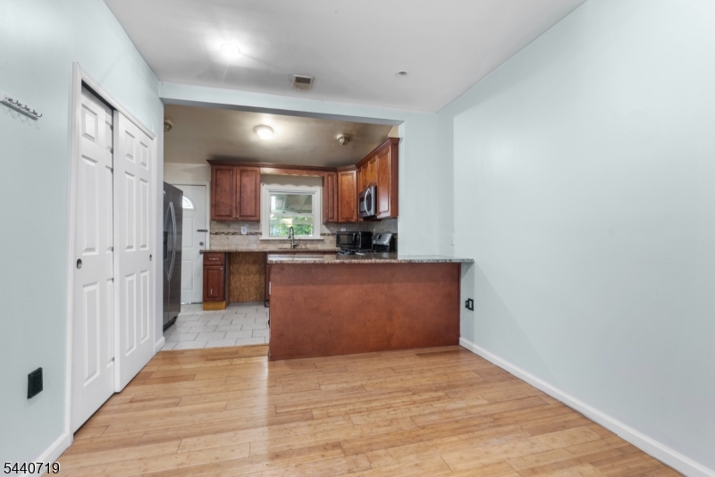 136 Smith Street Elizabeth, NJ 07201 - Photo 8 of 38 a view of kitchen with wooden floor