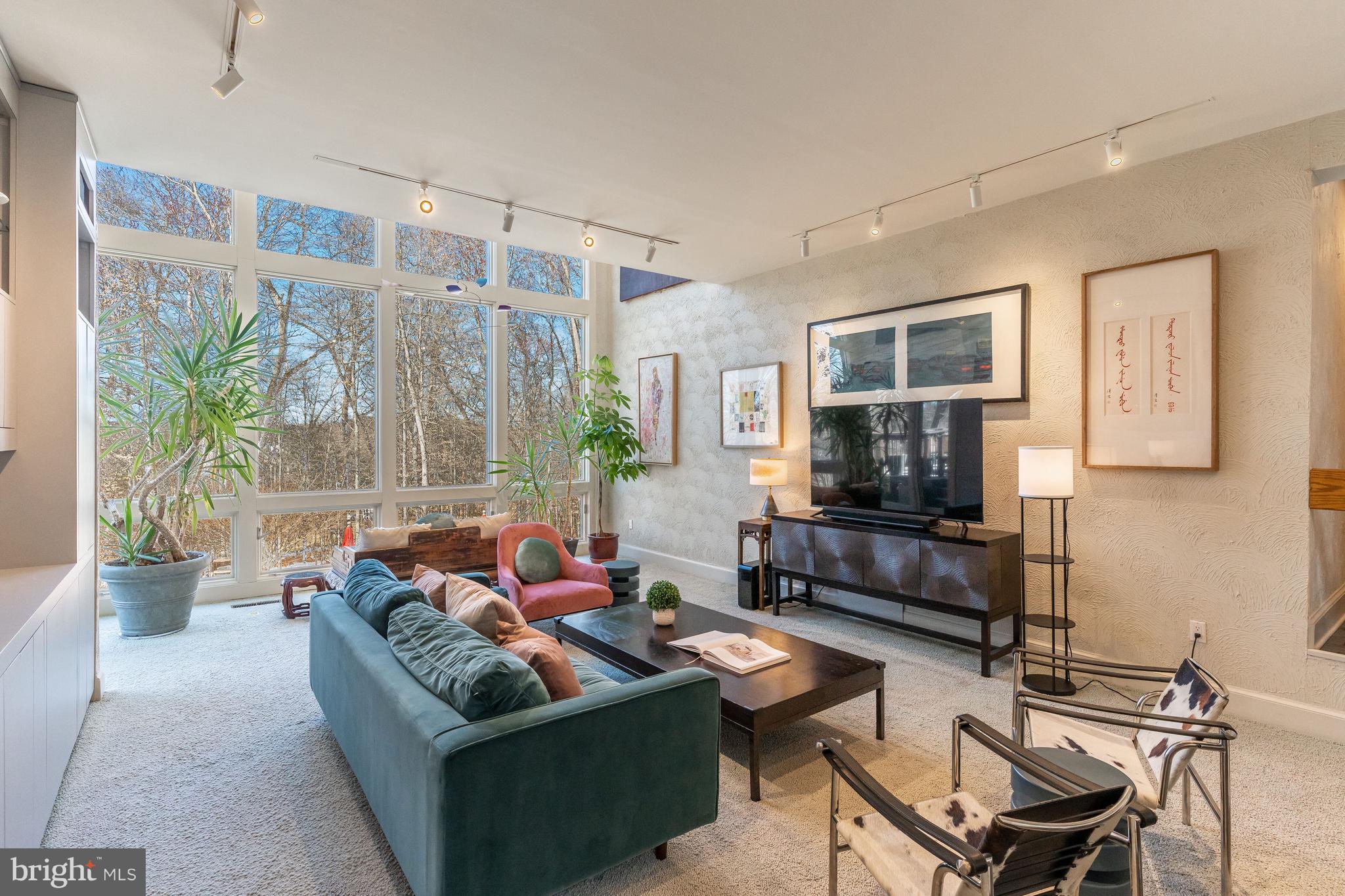 11000 Tara Road Potomac, MD 20854 - Photo 14 of 44 Family with Two- Story Wall of Windows