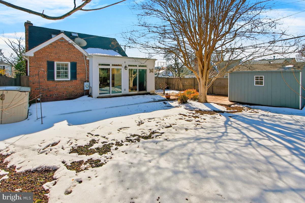 100 East Maple Street Alexandria, VA 22301 - Photo 103 of 114 a view of a house with a snow in the yard