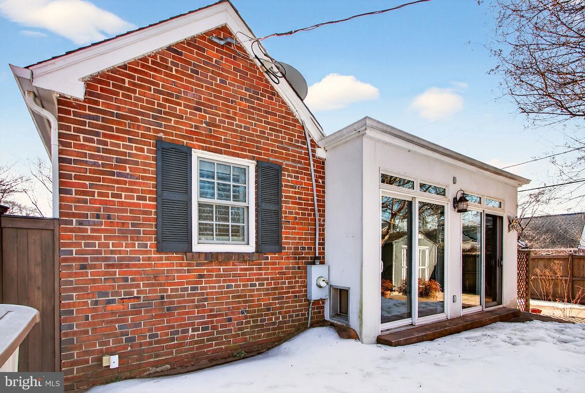 100 East Maple Street Alexandria, VA 22301 - Photo 106 of 114 a view of a brick house with large windows