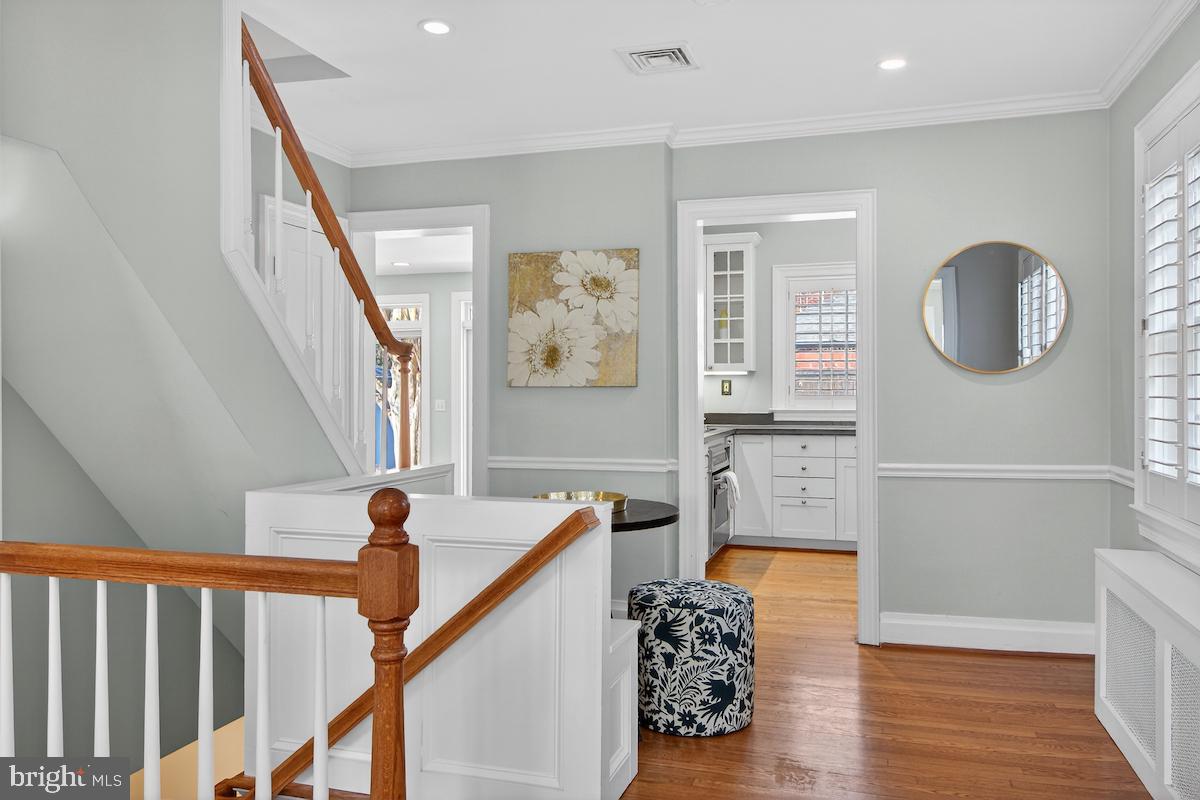 100 East Maple Street Alexandria, VA 22301 - Photo 16 of 114 a view of a hallway with wooden floor and staircase