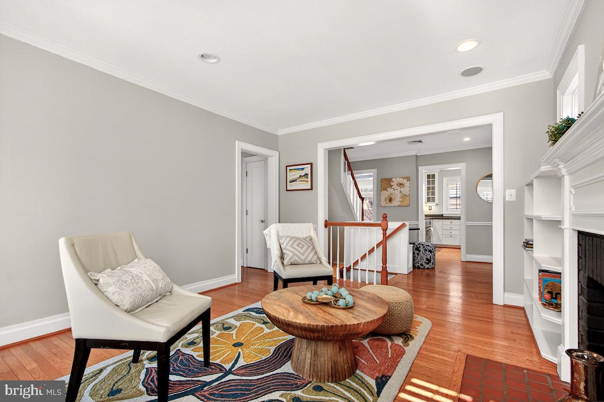 100 East Maple Street Alexandria, VA 22301 - Photo 6 of 114 a living room with furniture and a dining table with wooden floor