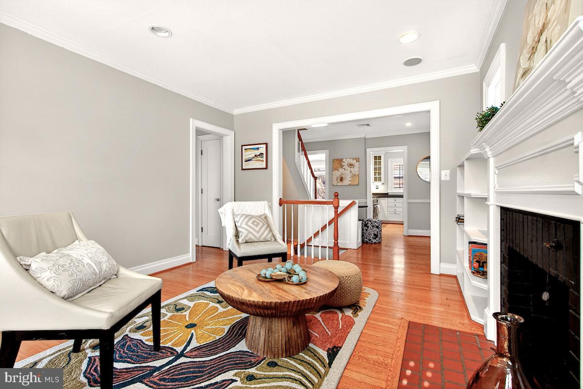 100 East Maple Street Alexandria, VA 22301 - Photo 7 of 114 a living room with furniture and a fireplace