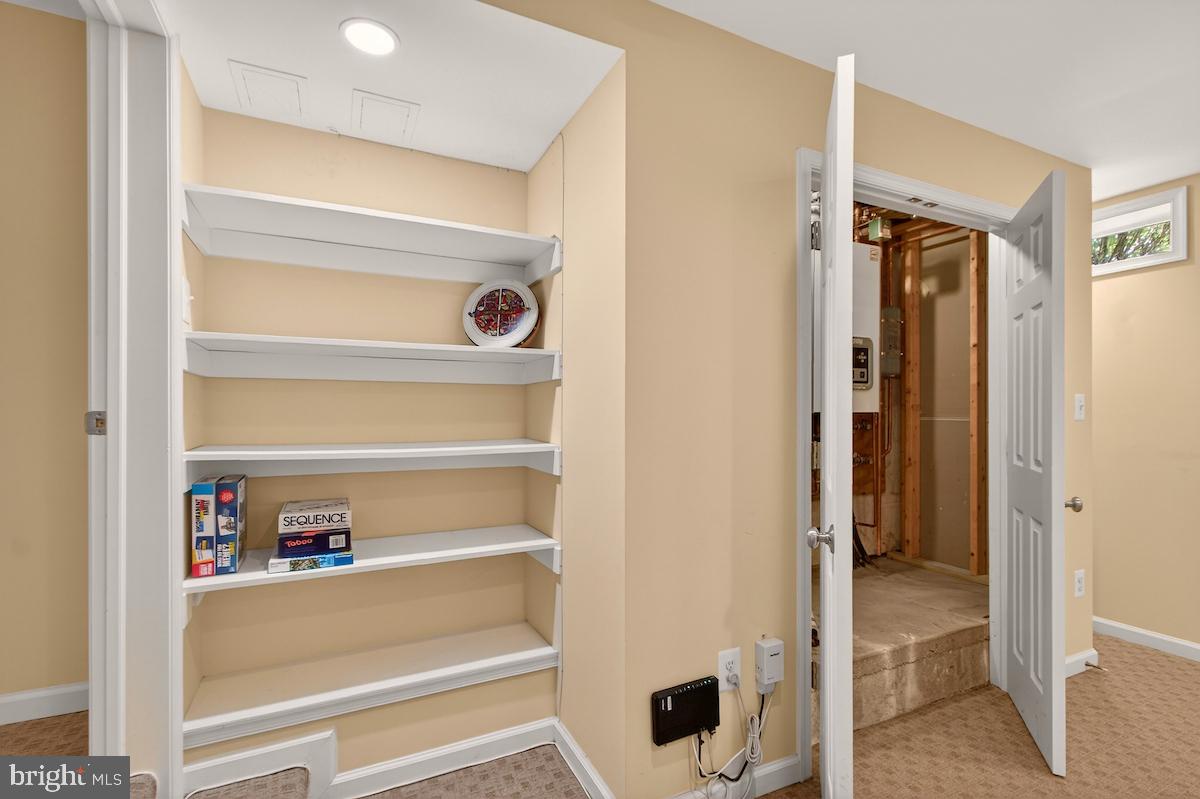 100 East Maple Street Alexandria, VA 22301 - Photo 79 of 114 a view of walk in closet with empty racks
