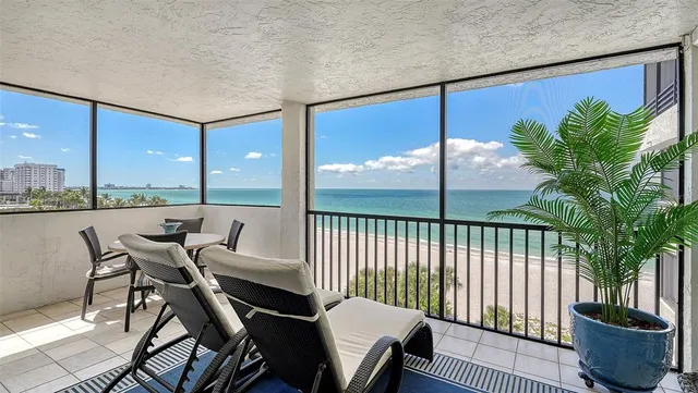 a view of a city from a dining room with furniture
