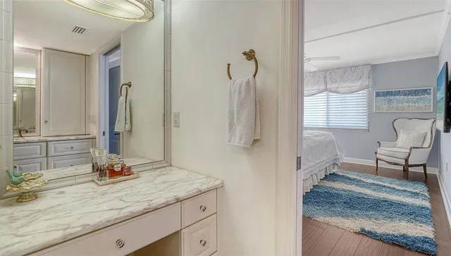 a view of an ocean with boats and palm trees