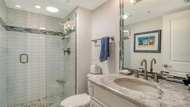 a living room with furniture and large windows