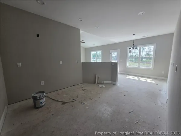 an empty room with closet and door