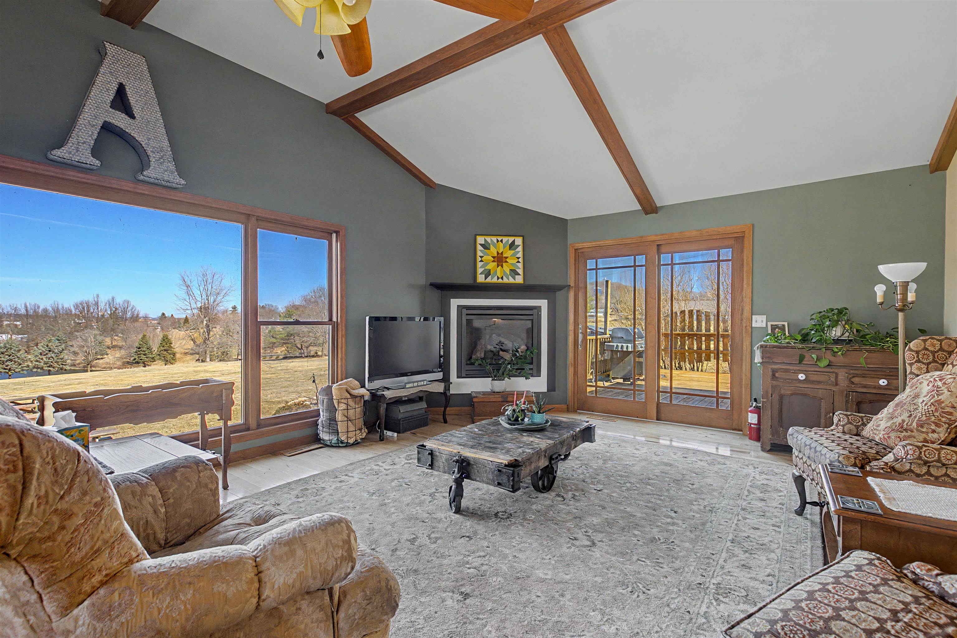 115 Windmill Road Elizabeth, IL 61028 - Photo 7 of 66 a living room with furniture and a floor to ceiling window