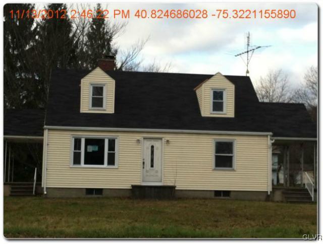 283 East Moorestown Road Wind Gap, PA 18091 - Photo 1 of 20 a front view of a house with a yard