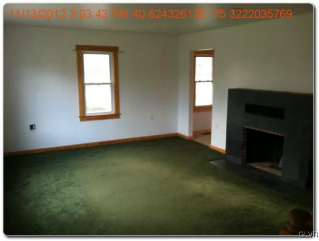 283 East Moorestown Road Wind Gap, PA 18091 - Photo 3 of 20 an empty room with a fireplace