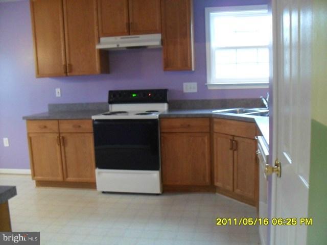 181 Ranson Estates Circle Ranson, WV 25438 - Photo 14 of 29 a kitchen with a stove and a sink