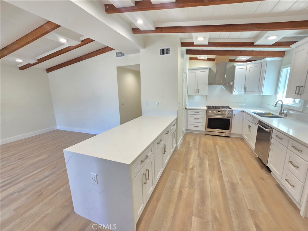 34516 Via Verde Dana Point, CA 92624 - Photo 3 of 15 a spacious bathroom with a double vanity sink and a mirror