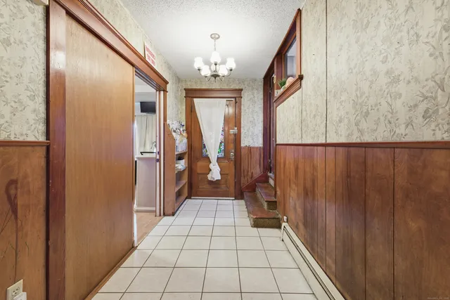 a bedroom with a bed a window and couch