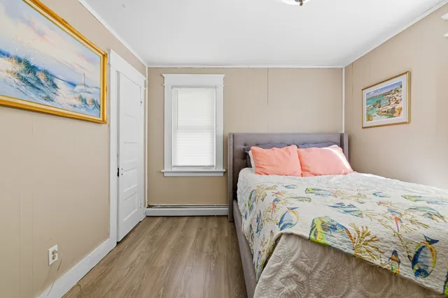 a bathroom with a shower sink vanity and mirror