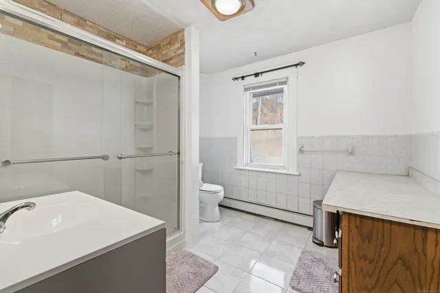 a bedroom with a bed and furniture