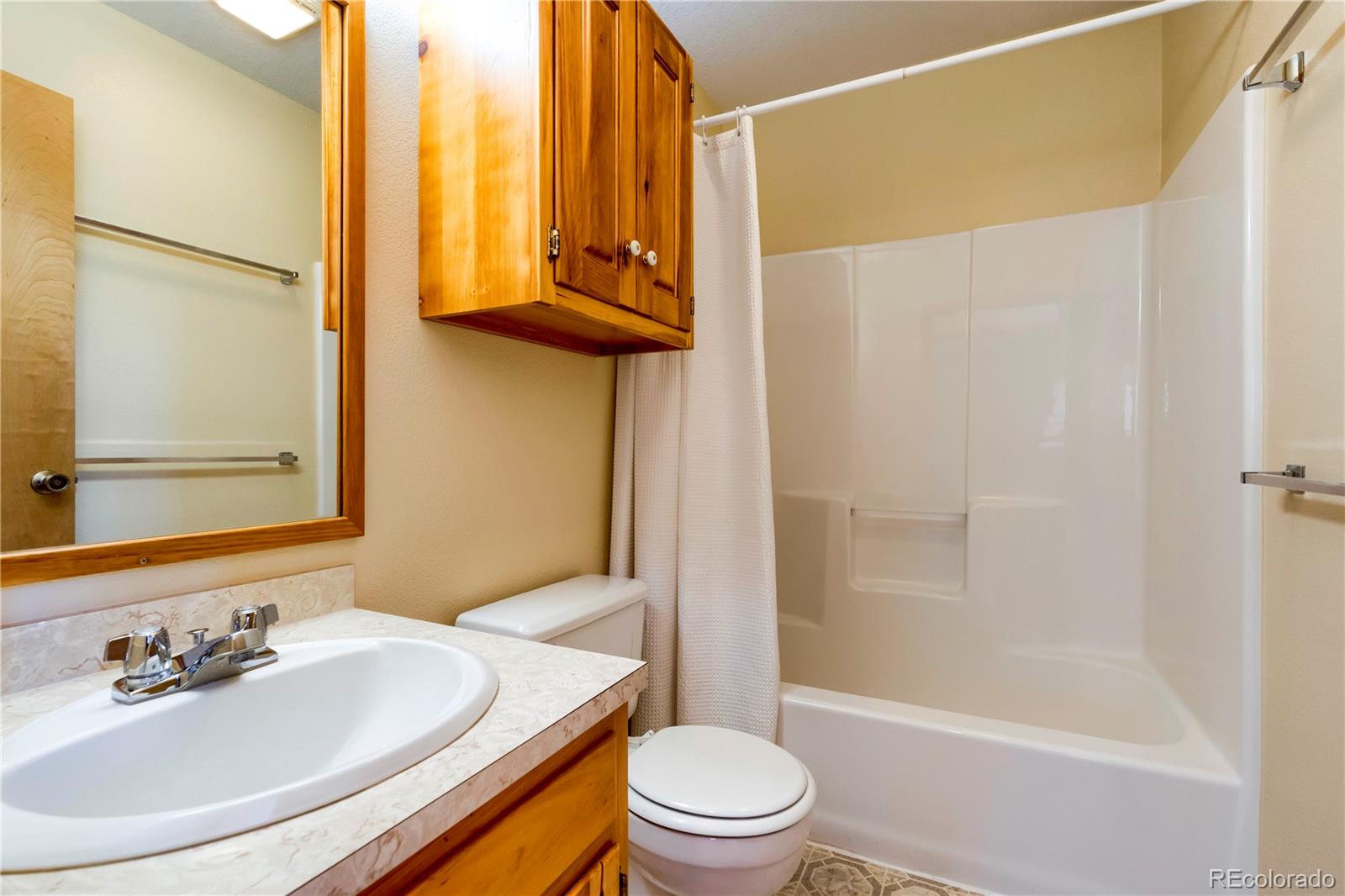 499 Kings Crossing Road Winter Park, CO 80482 - Photo 15 of 30 a bathroom with a sink a toilet and shower