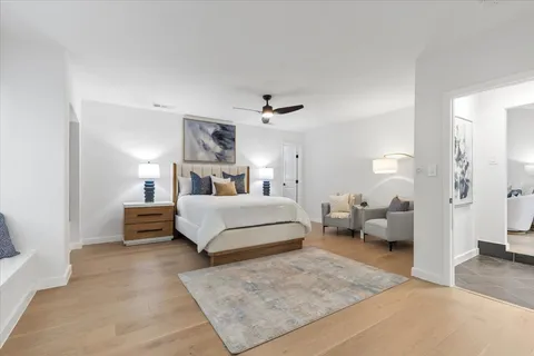 a bedroom with a large bed and furniture
