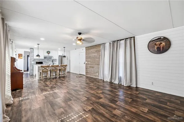 a view of a livingroom with furniture and an entryway