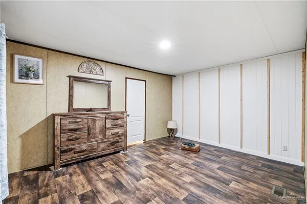 a view of room with window and flat screen tv