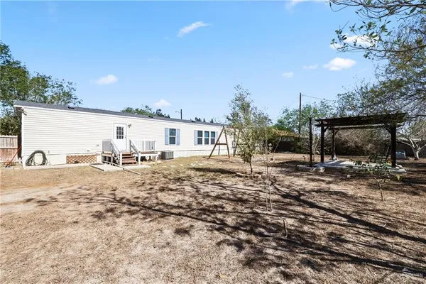 a view of a backyard of a house