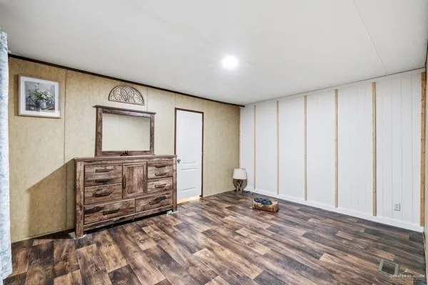 a view of a bedroom with cabinet cabinet and flat screen tv