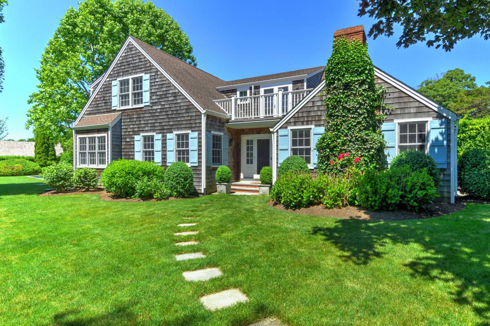162 Sayre's Path Wainscott, NY 11975 - Photo 1 of 11 a front view of a house with a yard