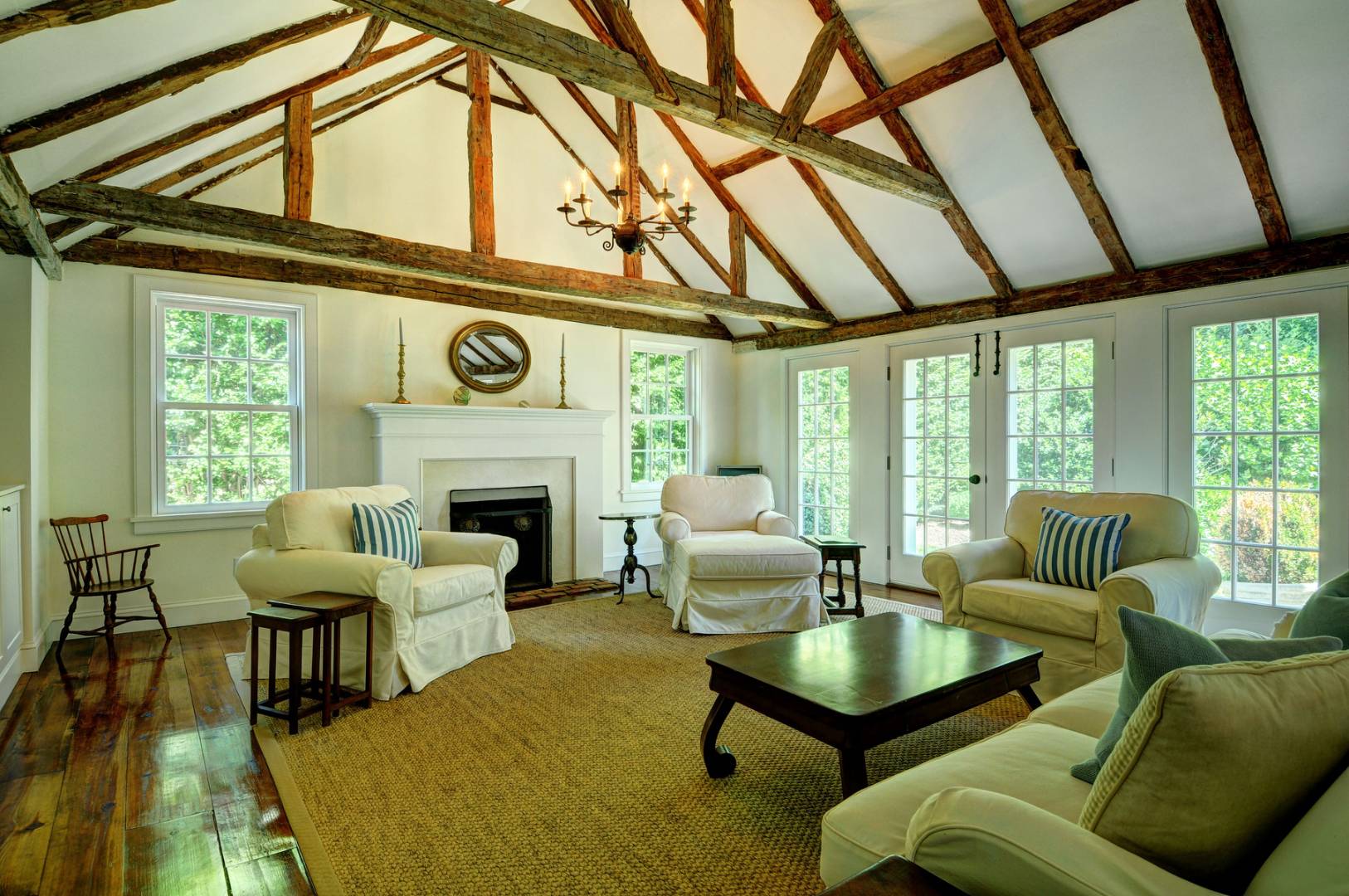 162 Sayre's Path Wainscott, NY 11975 - Photo 5 of 11 a living room with furniture a fireplace windows and a table