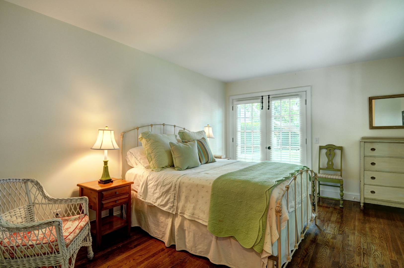 162 Sayre's Path Wainscott, NY 11975 - Photo 8 of 11 a bedroom with a bed and wooden floor