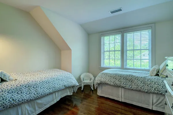 a bedroom with bed and window