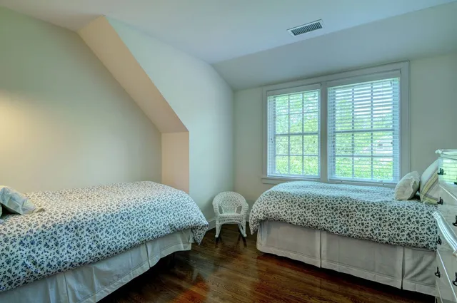 a bedroom with bed and window