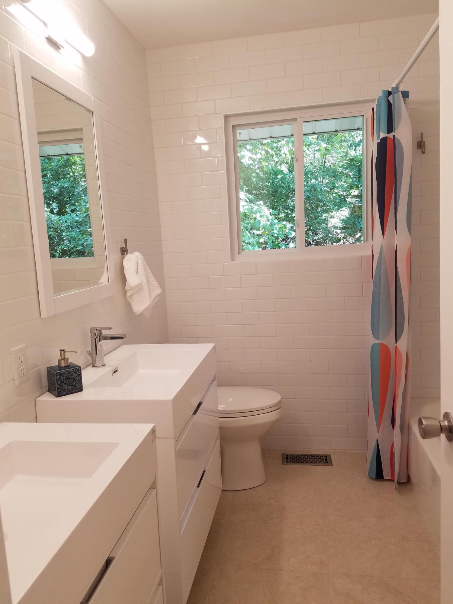 552 Foust Carney Road Powell, TN 37849 - Photo 18 of 35 a bathroom with a sink toilet and a mirror