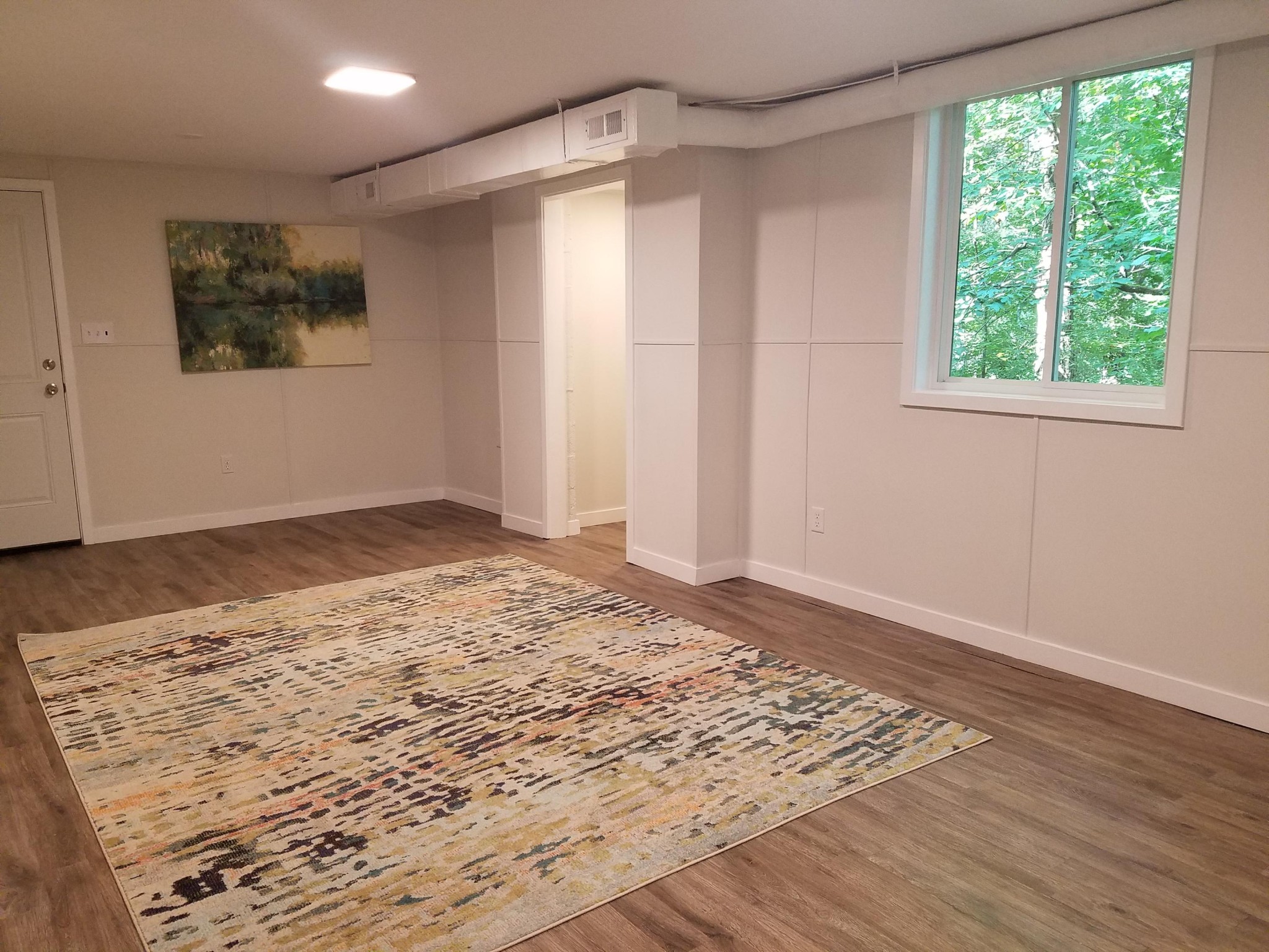 552 Foust Carney Road Powell, TN 37849 - Photo 29 of 35 a view of a big room with wooden floor and windows