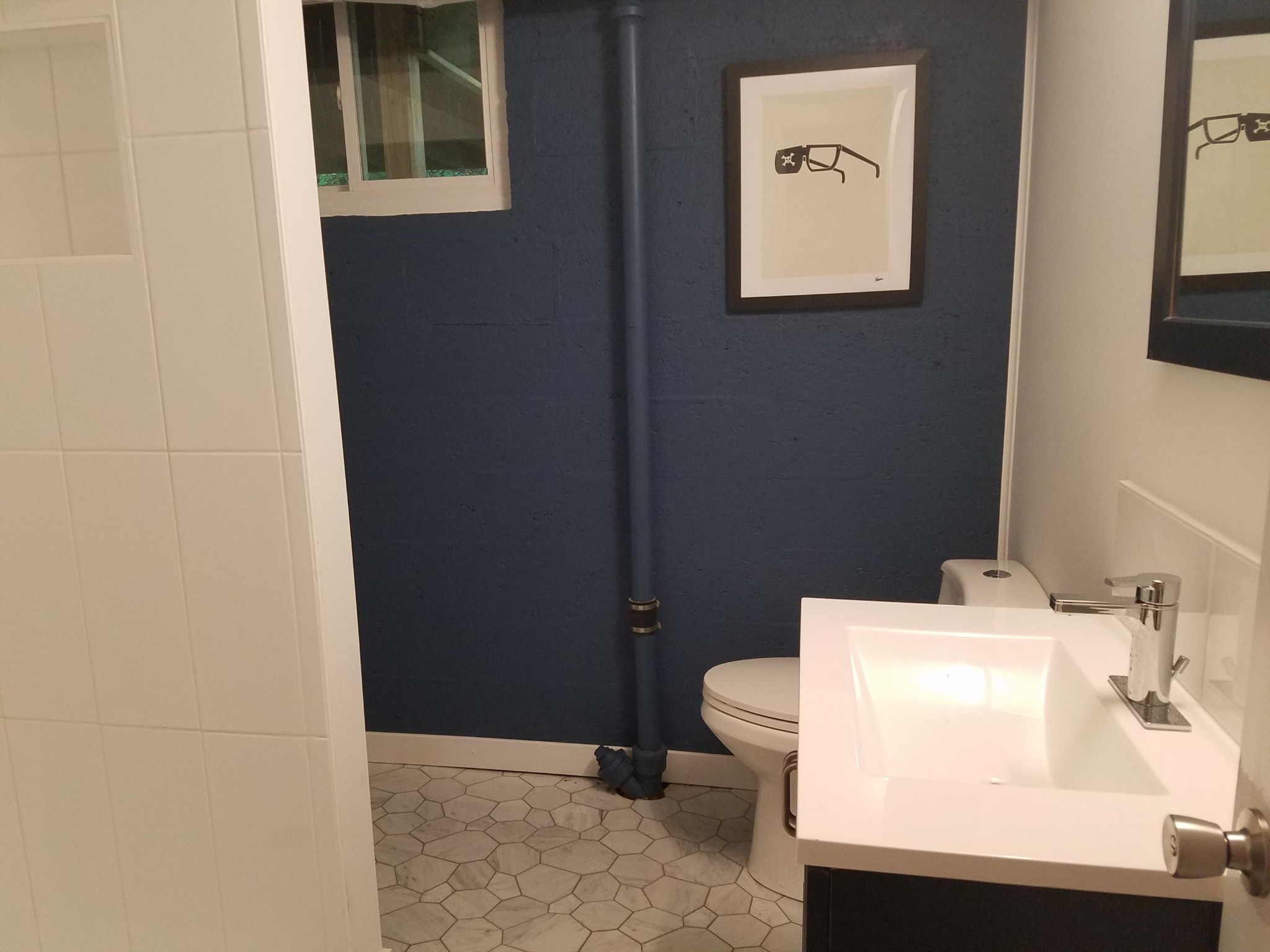 552 Foust Carney Road Powell, TN 37849 - Photo 33 of 35 a bathroom with a sink a toilet and a mirror