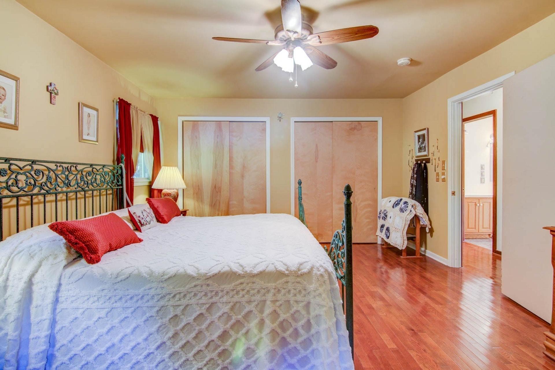 4682 Providence Church Road Ferrum, VA 24088 - Photo 20 of 43 a bedroom with a bed and wooden floor