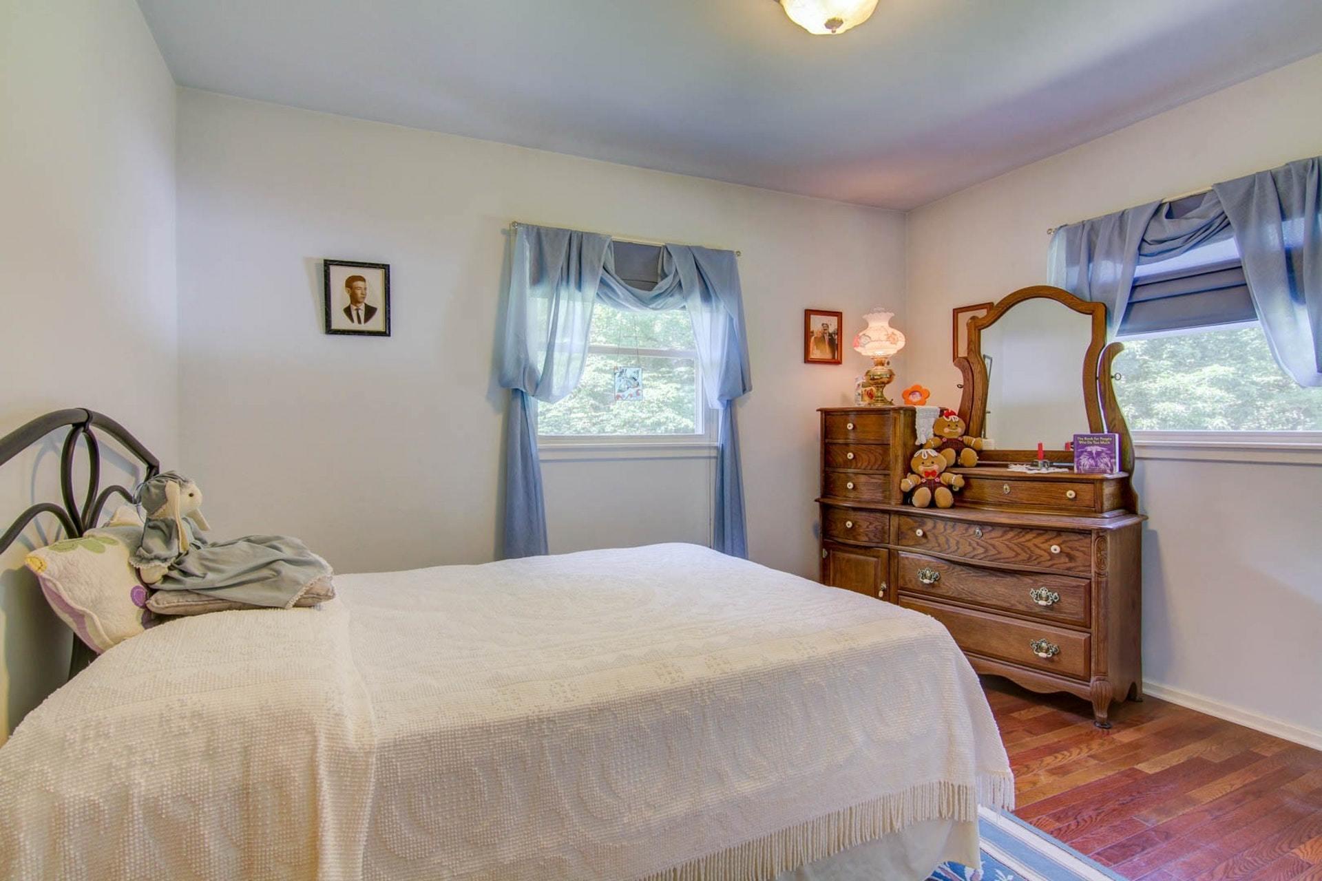 4682 Providence Church Road Ferrum, VA 24088 - Photo 21 of 43 a bedroom with a bed and a dresser in it