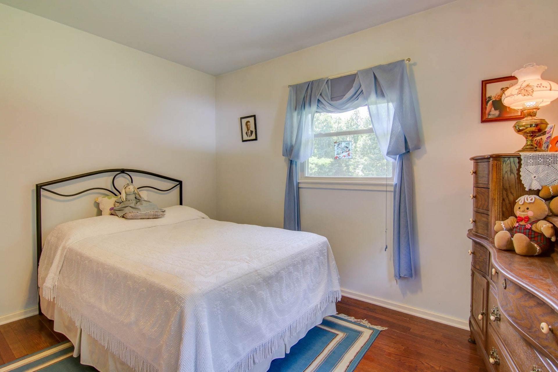 4682 Providence Church Road Ferrum, VA 24088 - Photo 22 of 43 a bedroom with a bed and a window
