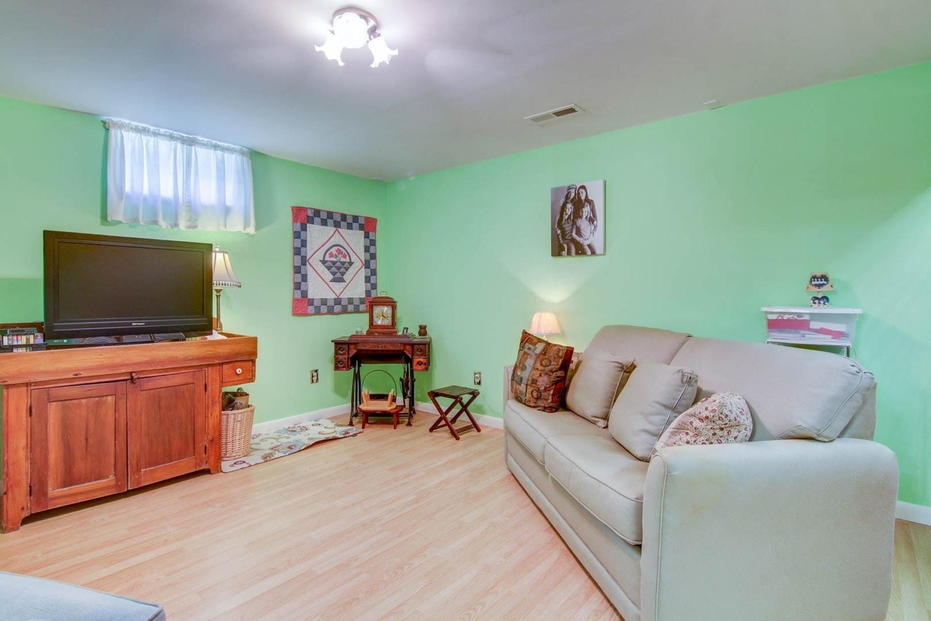 4682 Providence Church Road Ferrum, VA 24088 - Photo 31 of 43 a living room with furniture and a flat screen tv