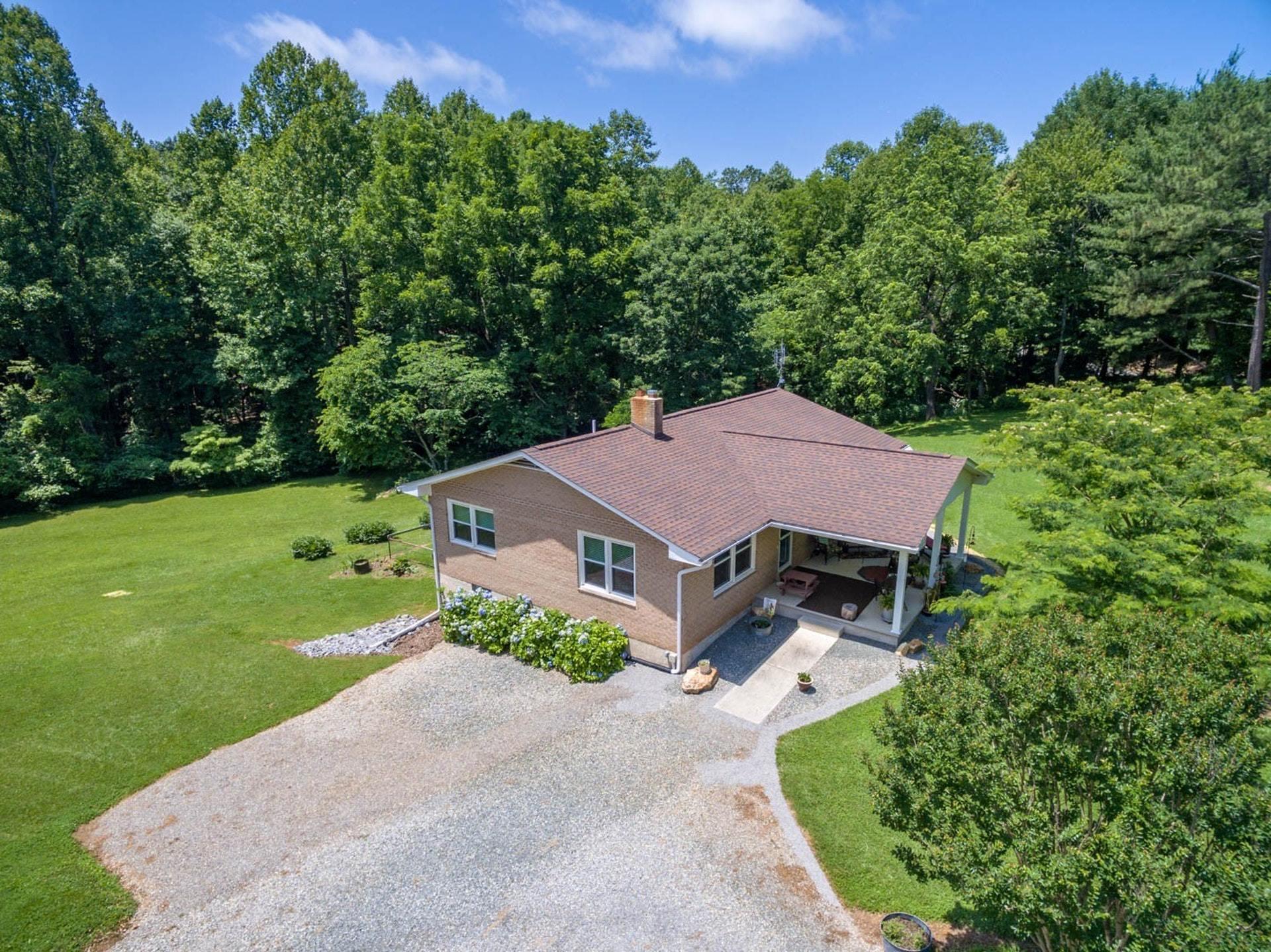 4682 Providence Church Road Ferrum, VA 24088 - Photo 5 of 43 an aerial view of a house with garden space and a patio