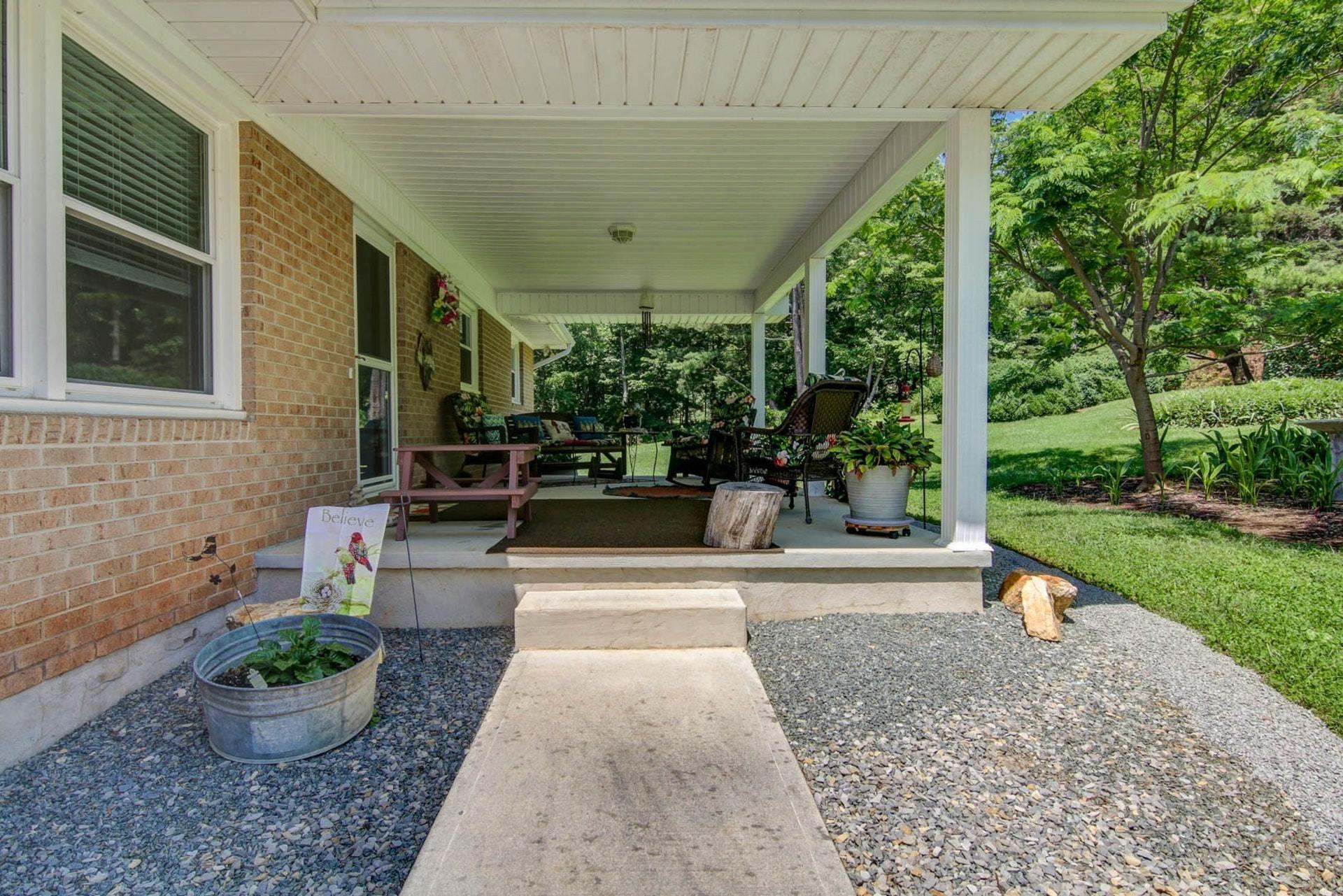 4682 Providence Church Road Ferrum, VA 24088 - Photo 7 of 43 a view of a patio with couches and plants