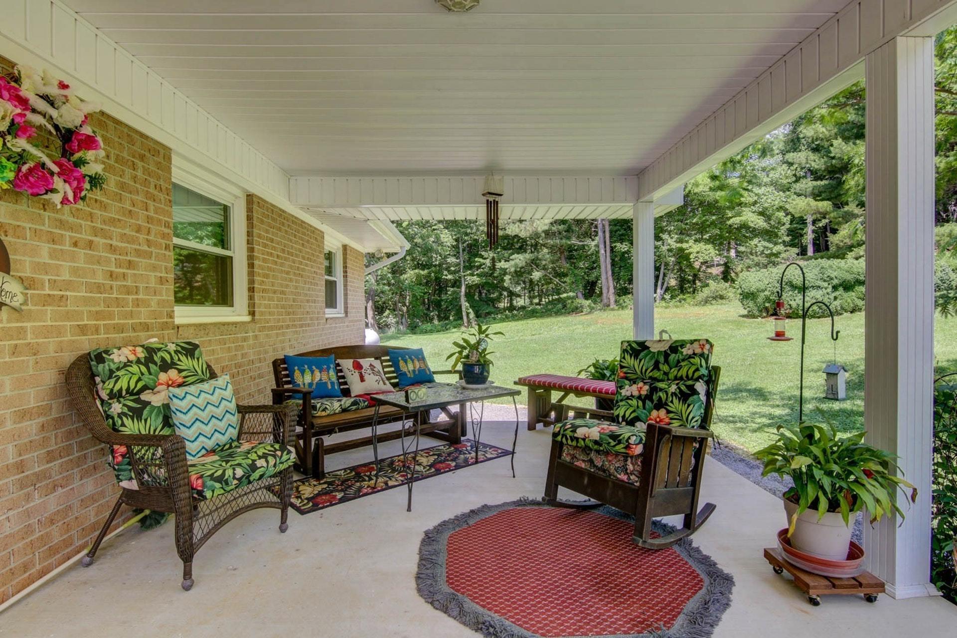 4682 Providence Church Road Ferrum, VA 24088 - Photo 8 of 43 a building outdoor space with furniture and potted plants