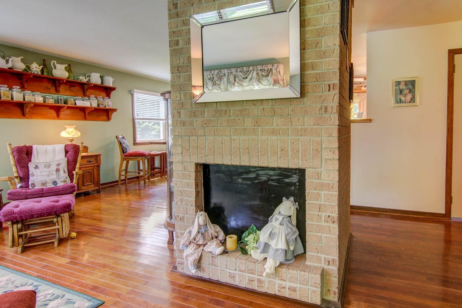 4682 Providence Church Road Ferrum, VA 24088 - Photo 10 of 43 a living room with furniture and a fireplace