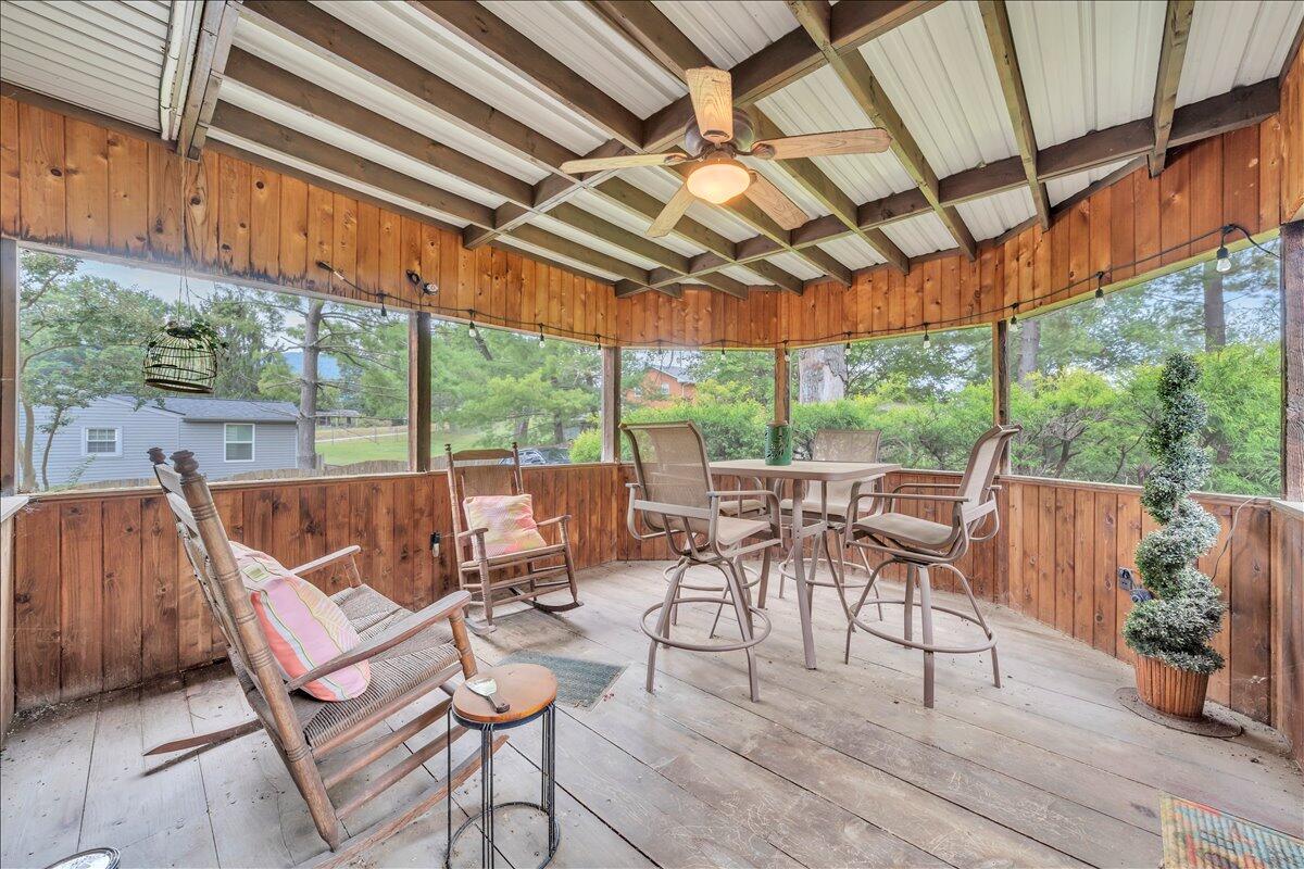 1525 West Ruritan Road Roanoke, VA 24012 - Photo 17 of 62 a view of a patio with table and chairs and wooden floor
