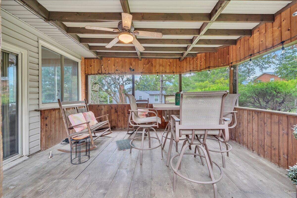 1525 West Ruritan Road Roanoke, VA 24012 - Photo 18 of 62 a view of a patio with table and chairs and wooden floor