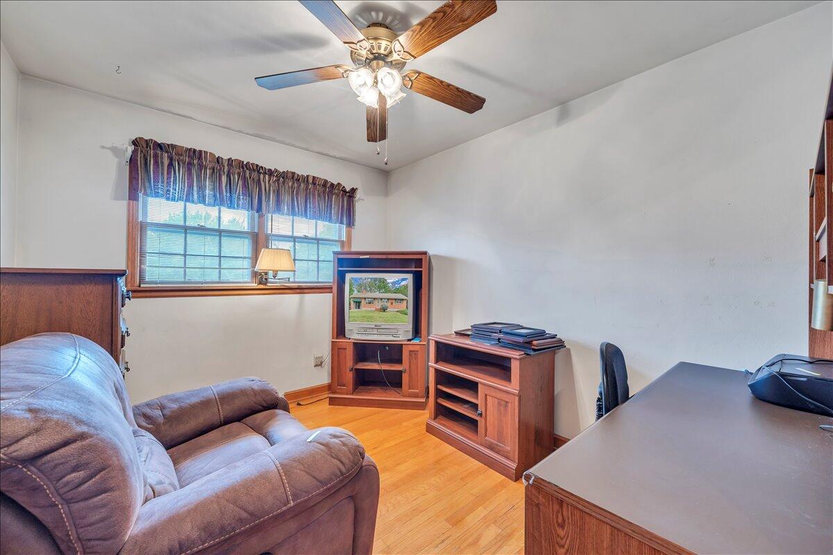1525 West Ruritan Road Roanoke, VA 24012 - Photo 19 of 62 a living room with furniture ceiling fan and a window