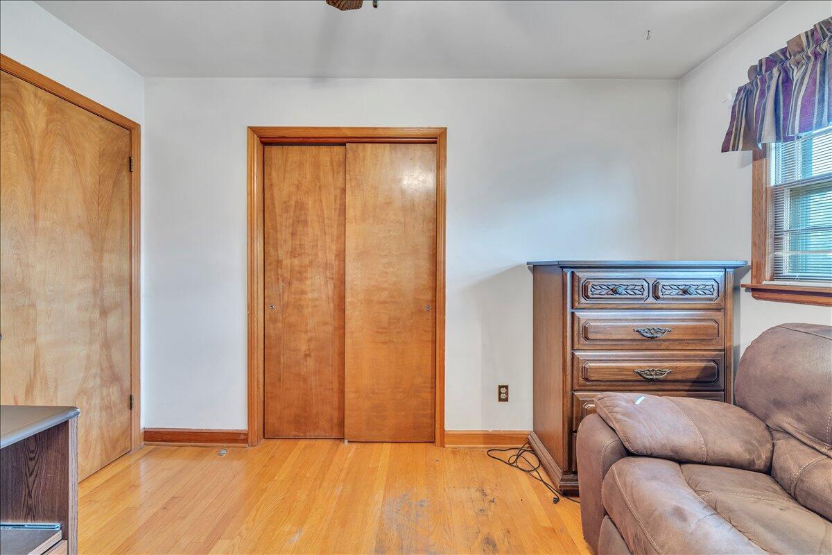 1525 West Ruritan Road Roanoke, VA 24012 - Photo 20 of 62 a living room with a bed and furniture