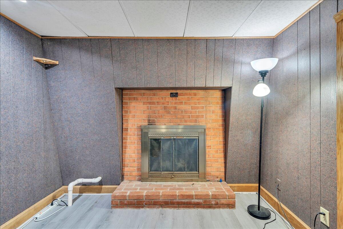 1525 West Ruritan Road Roanoke, VA 24012 - Photo 28 of 62 a living room with furniture and a fireplace