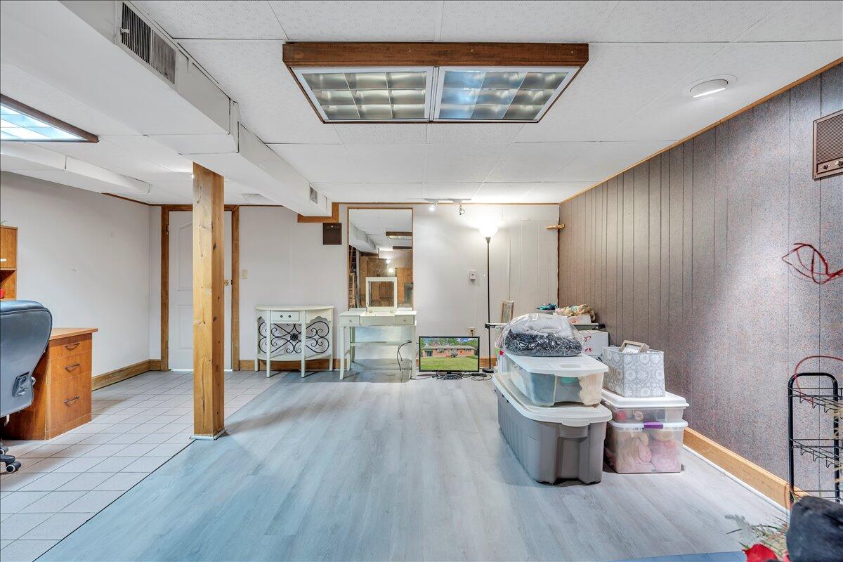 1525 West Ruritan Road Roanoke, VA 24012 - Photo 29 of 62 a dining room with furniture and wooden floor